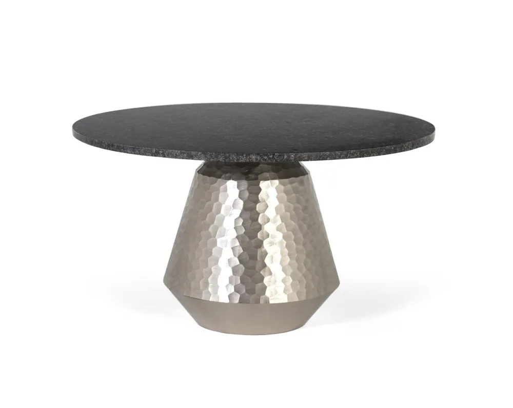 Esta mesa de centro redonda es una pieza sofisticada y con un marcado carácter artesanal. - Muebles